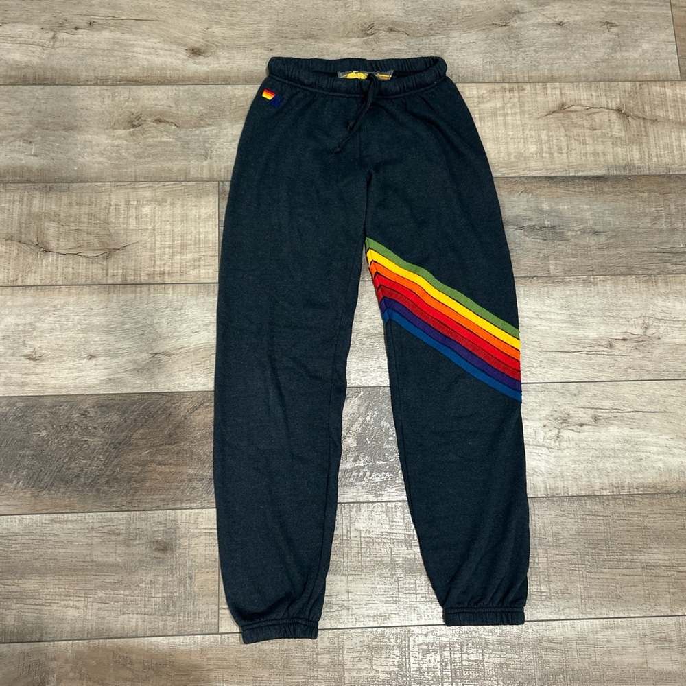 Aviator Nation charcoal sweatpants with rainbow chevron stripes